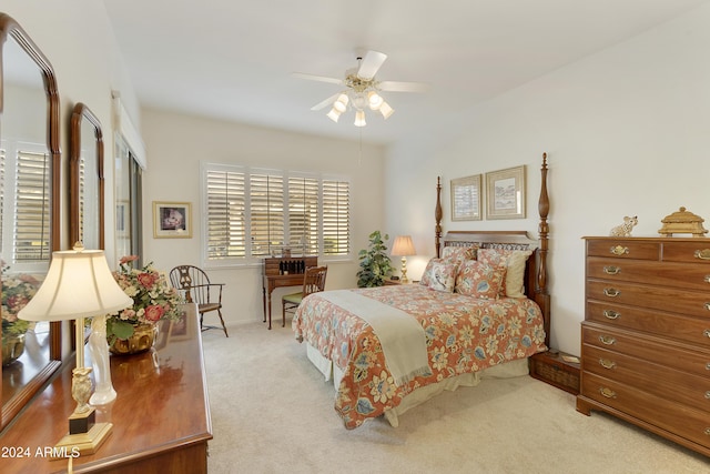 bedroom featuring light carpet and ceiling fan