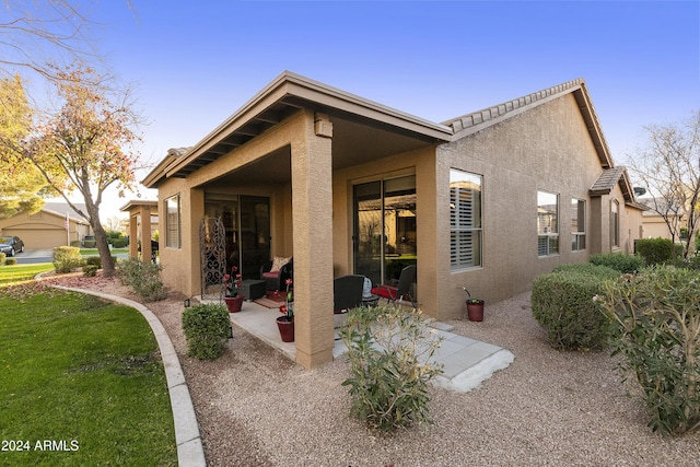 rear view of property with a patio