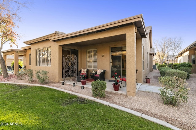 back of property with a patio area