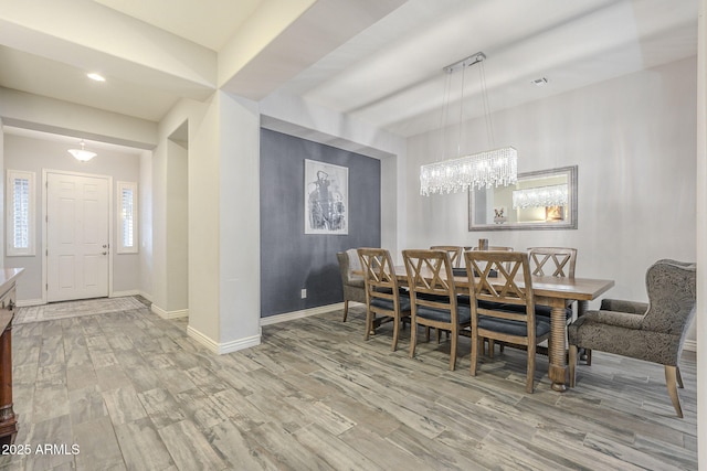 dining space featuring recessed lighting, wood finished floors, and baseboards