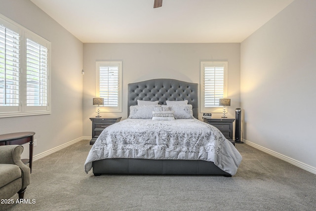 carpeted bedroom with a ceiling fan and baseboards