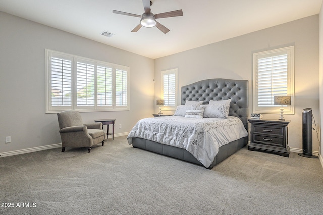 bedroom featuring visible vents, a ceiling fan, baseboards, and carpet floors