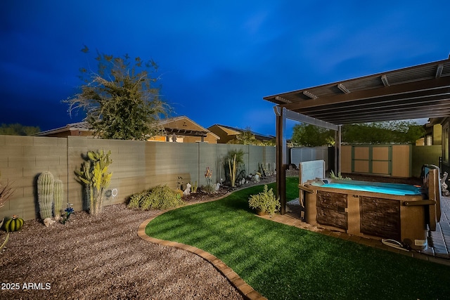 view of yard featuring an outdoor structure, a fenced backyard, and a shed