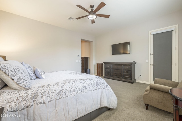 carpeted bedroom featuring visible vents, baseboards, and a ceiling fan