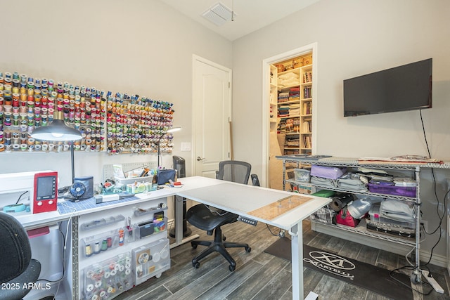 office featuring visible vents and wood finished floors