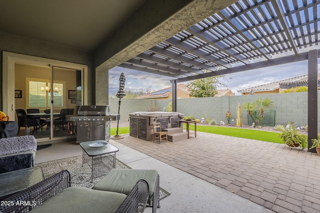 view of patio / terrace featuring grilling area, a pergola, and a fenced backyard