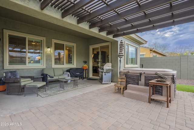 view of patio / terrace featuring fence, a grill, a pergola, a hot tub, and an outdoor hangout area