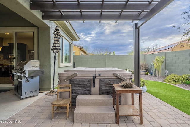 view of patio / terrace featuring area for grilling, a fenced backyard, a pergola, and a hot tub