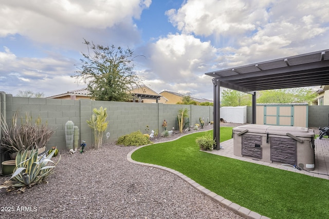 view of yard featuring a shed, a fenced backyard, an outbuilding, a pergola, and a patio