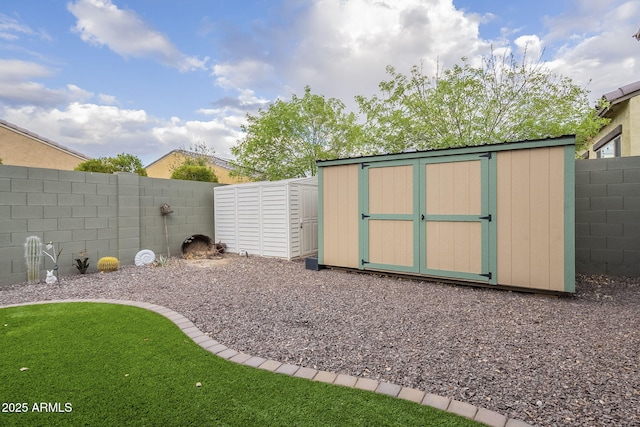 view of shed with a fenced backyard