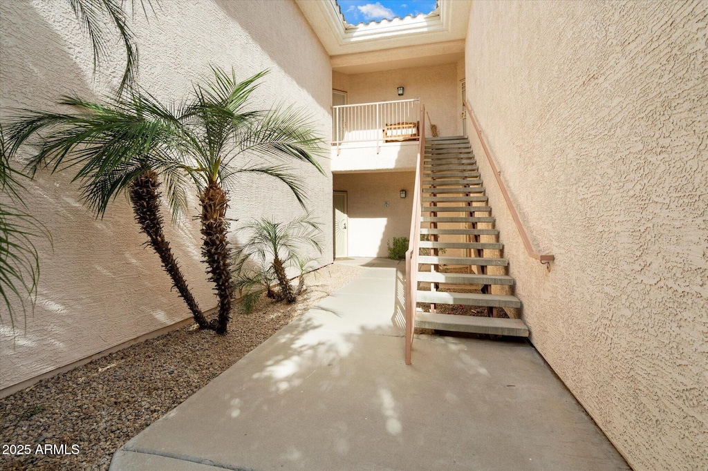 10030 W Indian School Rd Unit 240, Phoenix, AZ 85037 - stairs with a textured wall and a skylight