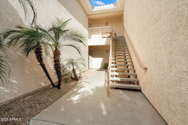 10030 W Indian School Rd Unit 240, Phoenix, AZ 85037 - stairs with a textured wall and a skylight