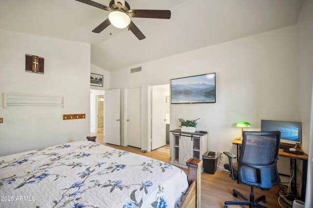 bedroom featuring ceiling fan, vaulted ceiling, and light hardwood / wood-style floors