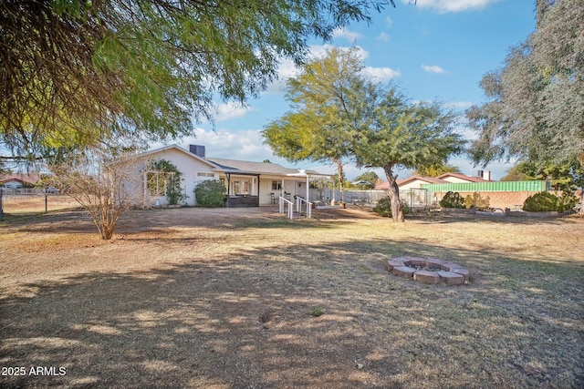 view of front of home with an outdoor fire pit