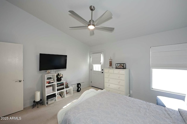 carpeted bedroom featuring vaulted ceiling and ceiling fan