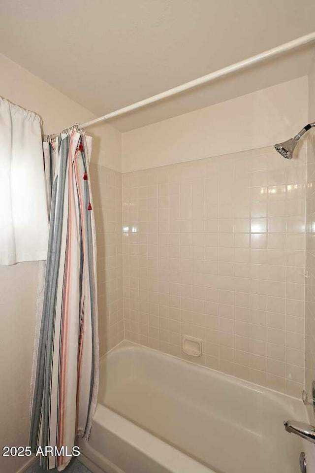 bathroom featuring shower / bath combination with curtain