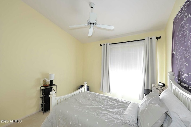 bedroom with light colored carpet and ceiling fan