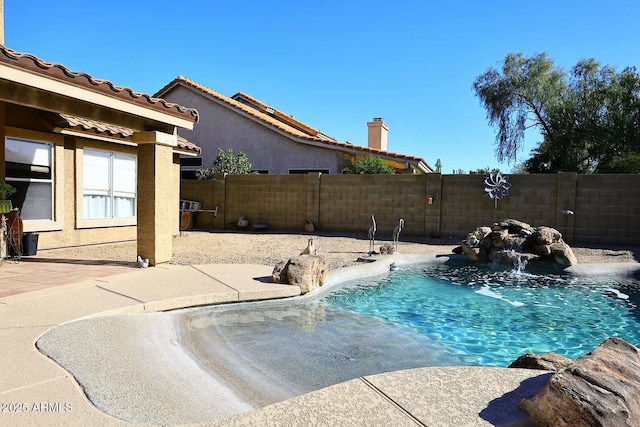 view of swimming pool featuring pool water feature