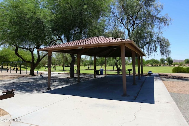 surrounding community with a gazebo and a yard