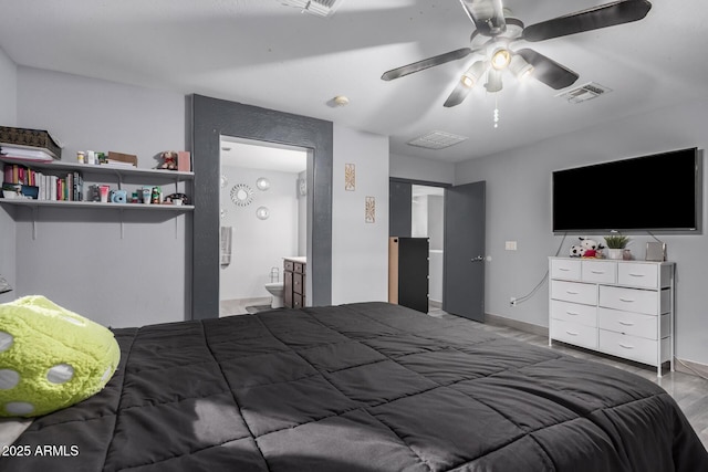 bedroom featuring hardwood / wood-style flooring, ceiling fan, and connected bathroom