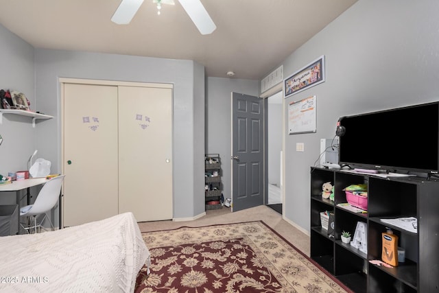 bedroom with carpet flooring, ceiling fan, and a closet