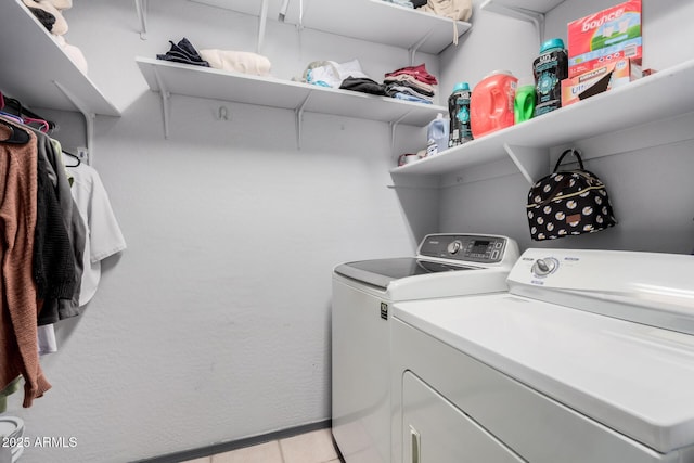 laundry area with independent washer and dryer