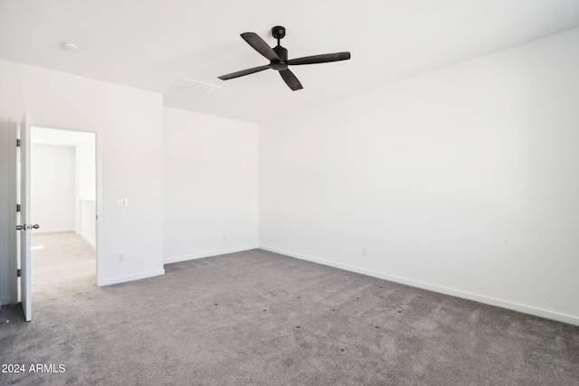 spare room featuring carpet flooring and ceiling fan