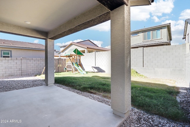 view of patio featuring a playground