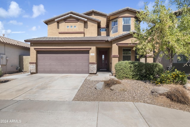 4512 W Stoneman Dr, Anthem, AZ 85086 - view of front of house featuring driveway, stucco siding, an attached garage, and stone siding