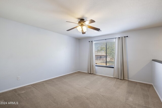4512 W Stoneman Dr, Anthem, AZ 85086 - carpeted spare room featuring ceiling fan and baseboards