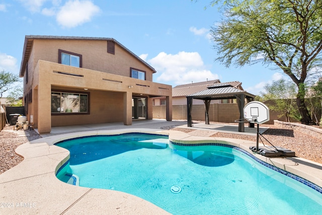 view of pool with a patio and a gazebo