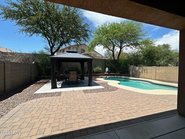 4512 W Stoneman Dr, Anthem, AZ 85086 - view of swimming pool with a patio area, a gazebo, and a fenced backyard