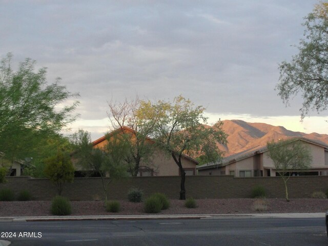 4512 W Stoneman Dr, Anthem, AZ 85086 - view of side of property featuring a mountain view, fence, and stucco siding