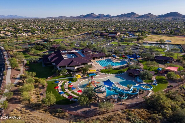 4512 W Stoneman Dr, Anthem, AZ 85086 - aerial view of property and surrounding area featuring a mountain backdrop and a pool