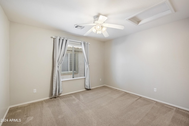 4512 W Stoneman Dr, Anthem, AZ 85086 - spare room featuring attic access, carpet flooring, a ceiling fan, and baseboards