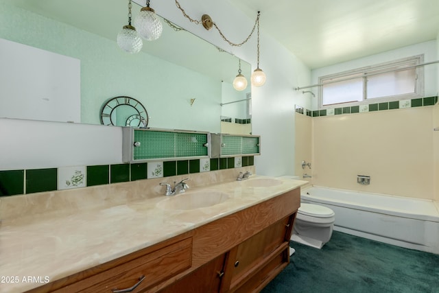 full bathroom featuring double vanity, toilet, shower / tub combination, and a sink