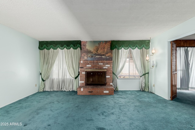 unfurnished living room featuring carpet floors, a textured ceiling, and a fireplace