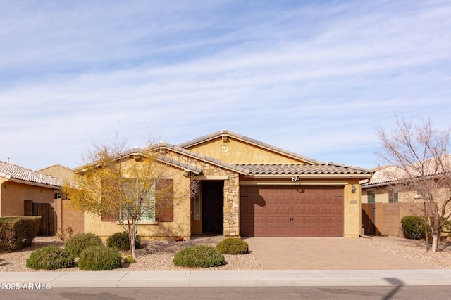 view of front of home with a garage