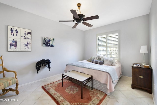 bedroom featuring a ceiling fan, baseboards, and light tile patterned floors