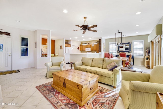 living room with ceiling fan, light tile patterned flooring, and recessed lighting