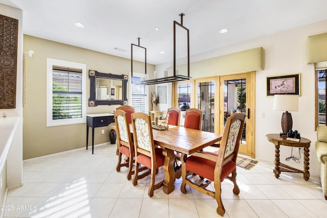 dining room with recessed lighting, baseboards, and light tile patterned flooring