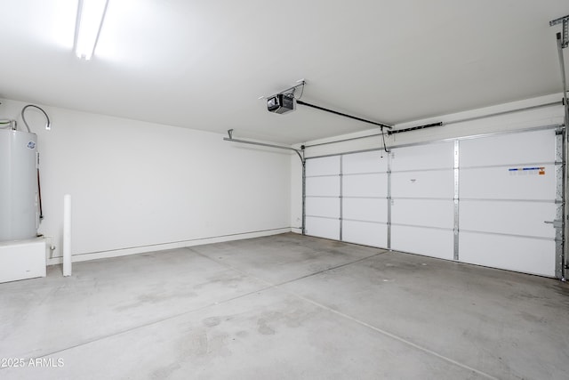 garage with a garage door opener and electric water heater