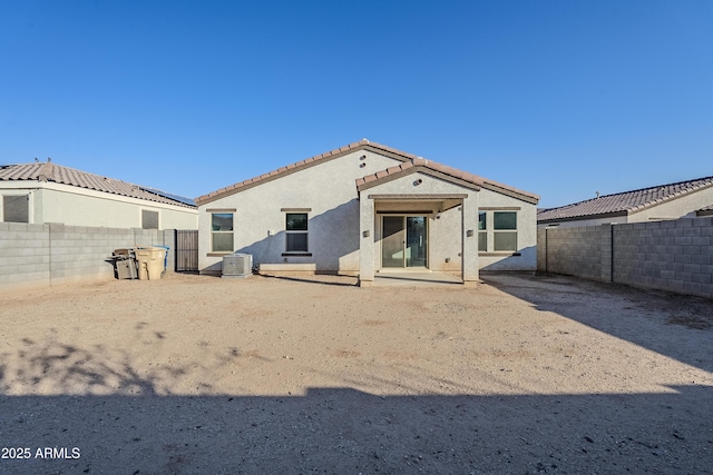 back of house with a patio