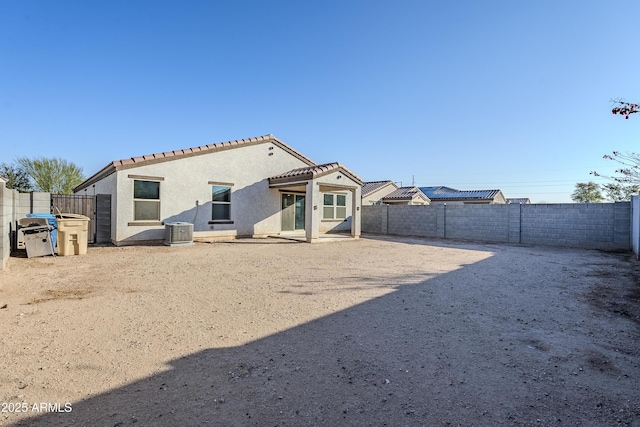 rear view of property featuring cooling unit