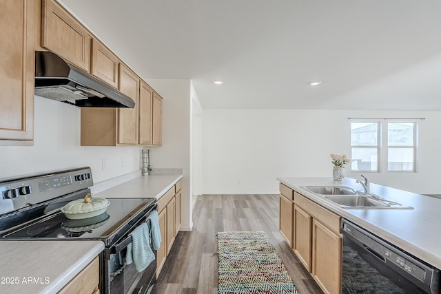 kitchen with hardwood / wood-style flooring, sink, light brown cabinetry, and black appliances