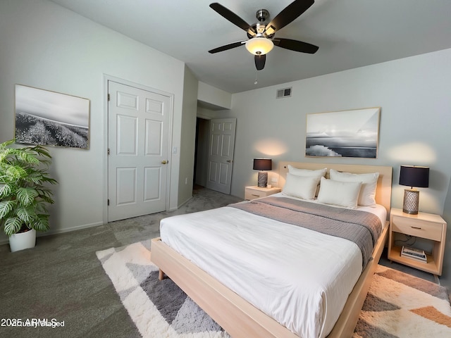 bedroom featuring a ceiling fan, baseboards, visible vents, and carpet flooring