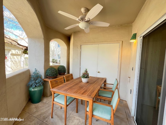 view of patio / terrace featuring ceiling fan and outdoor dining area