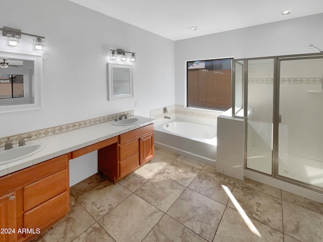 bathroom with vanity, independent shower and bath, and tile patterned flooring