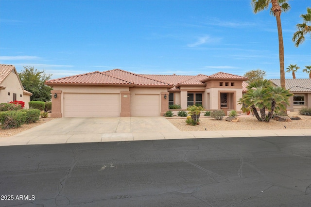 mediterranean / spanish-style home with a garage