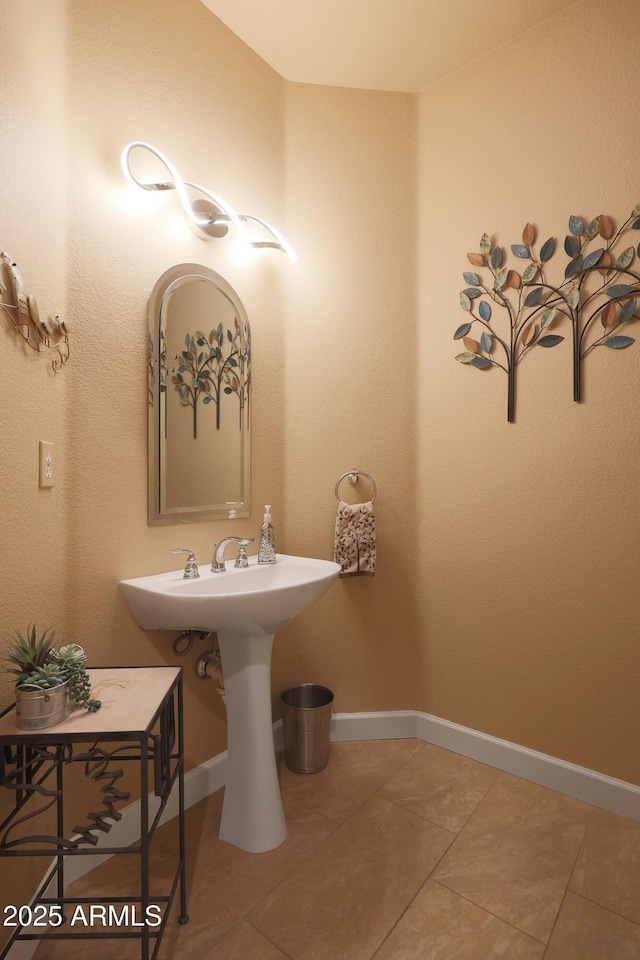 bathroom with tile patterned flooring